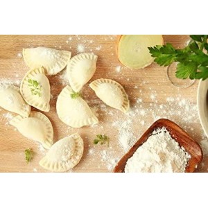 small pierogies, dumplings, uszka press/maker. Makes four small pierogies at once