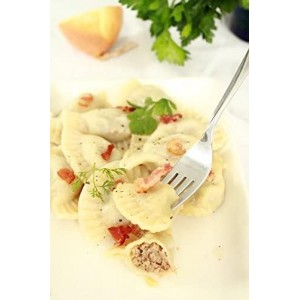 small pierogies, dumplings, uszka press/maker. Makes four small pierogies at once