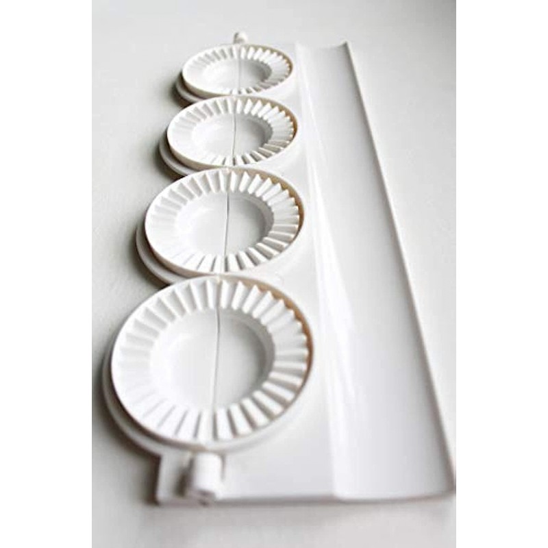 small pierogies, dumplings, uszka press/maker. Makes four small pierogies at once