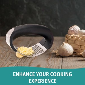Garlic press rocker, crusher, mincer tool stainless steel with a Garlic Peeler, spatula, and Brush extract more Garlic Paste. The Garlic Mincer Tool Squeezes, Extracts, Crushes
