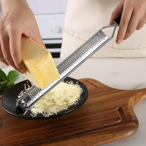 Cleaning Brush Included/Premium Stainless Steel Kitchen Grater - Sharp Handheld Zester for Cheese, Lemon, Garlic & Chocolate.